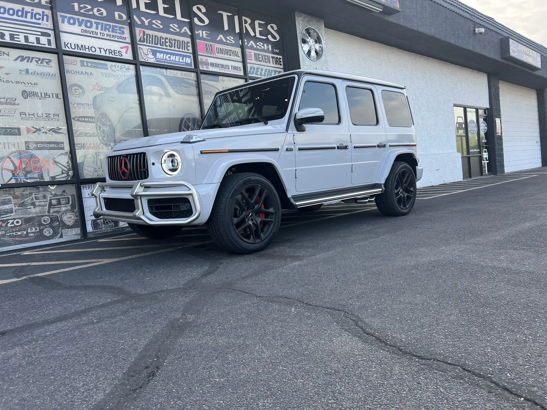 White Mercedes-AMG G 63 on black wheels outside SHM Motorsports in Mesa, AZ